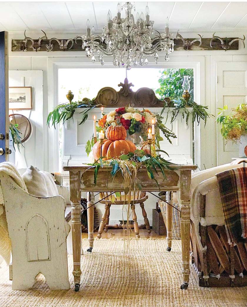 dining table with pumpkin and grass tablescape for a farmers market fall theme
