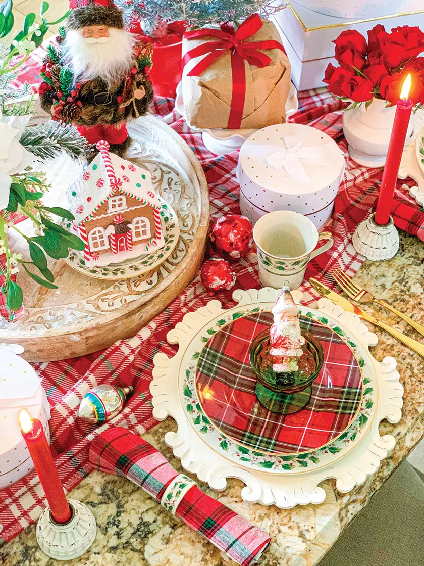 Christmas tablescape with Santa figurines and red taper candles