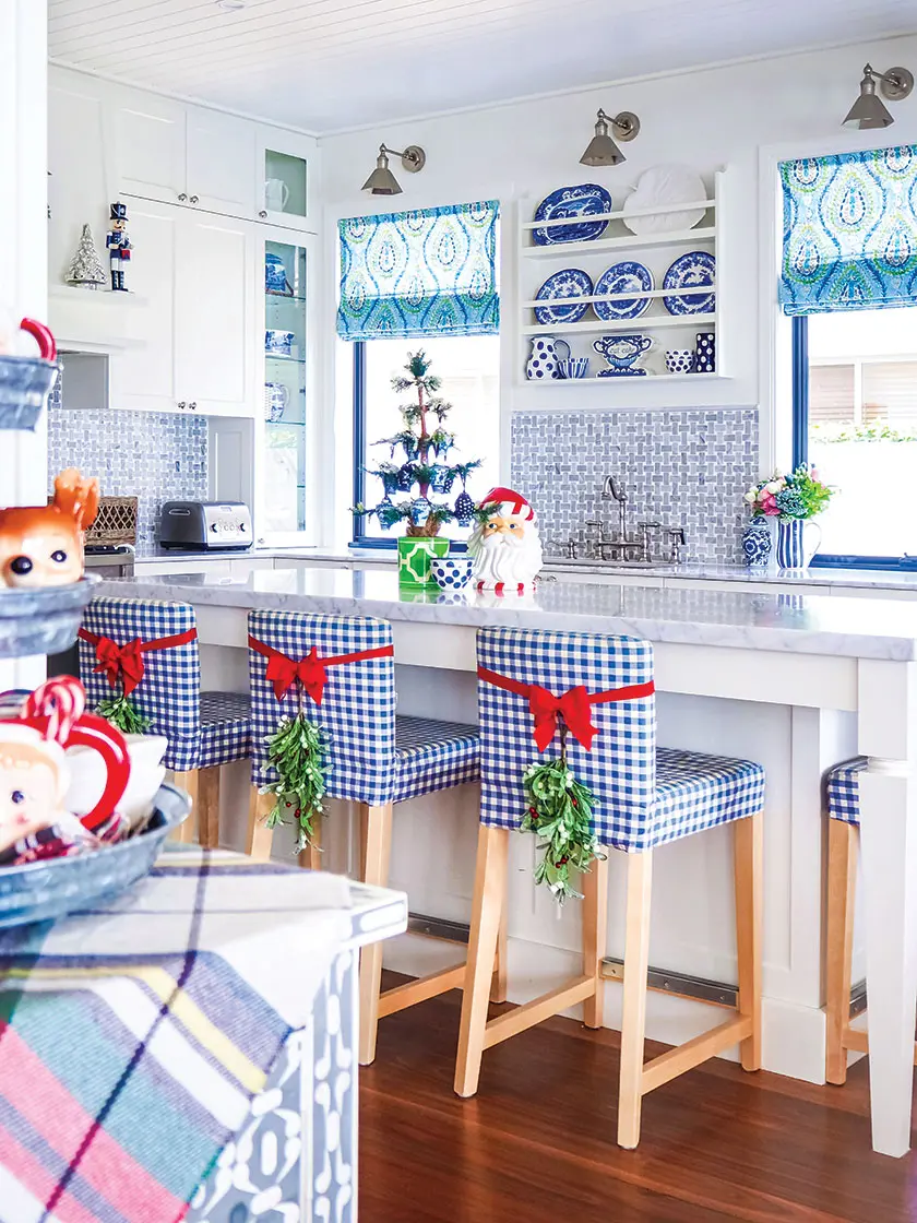 red ribbon and mistletoe in blue and white kitchen