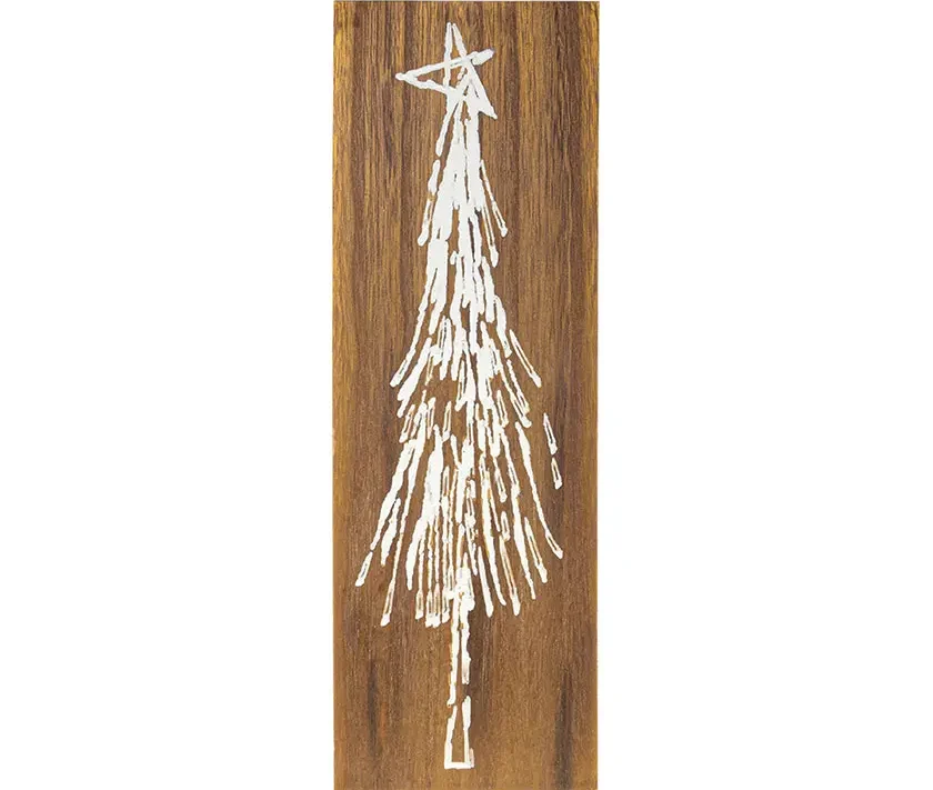 carved hemlock tree with star on plank
