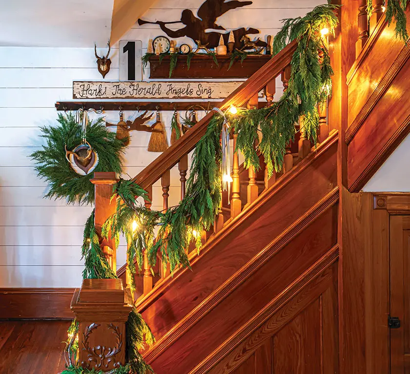 staircase with fresh greenery