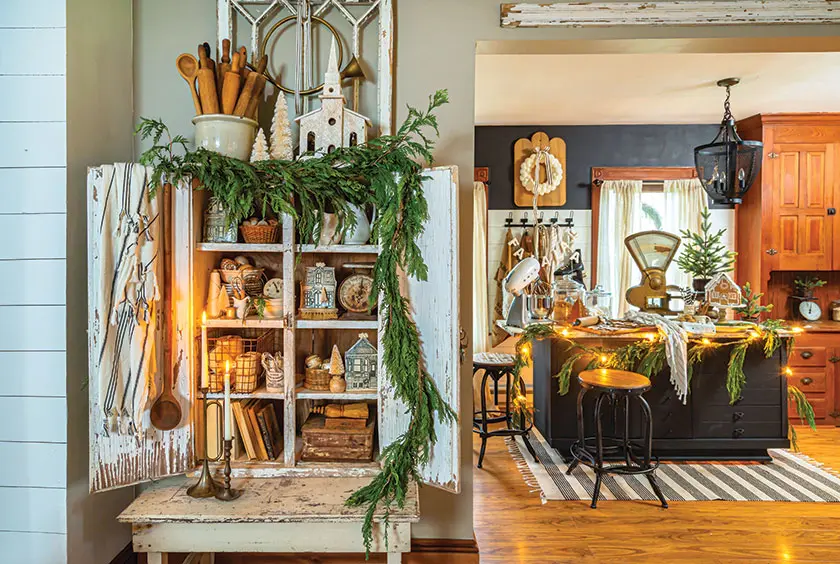 kitchen with fresh greenery and vintage putz houses and food scale