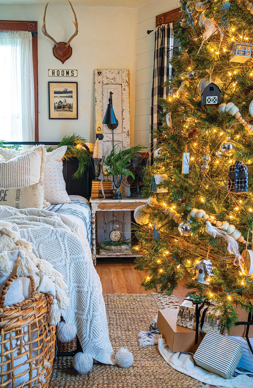 neutrals and vintage furniture in holiday bedroom with Christmas tree