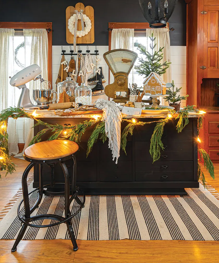 kitchen island with garland and vintage food scale