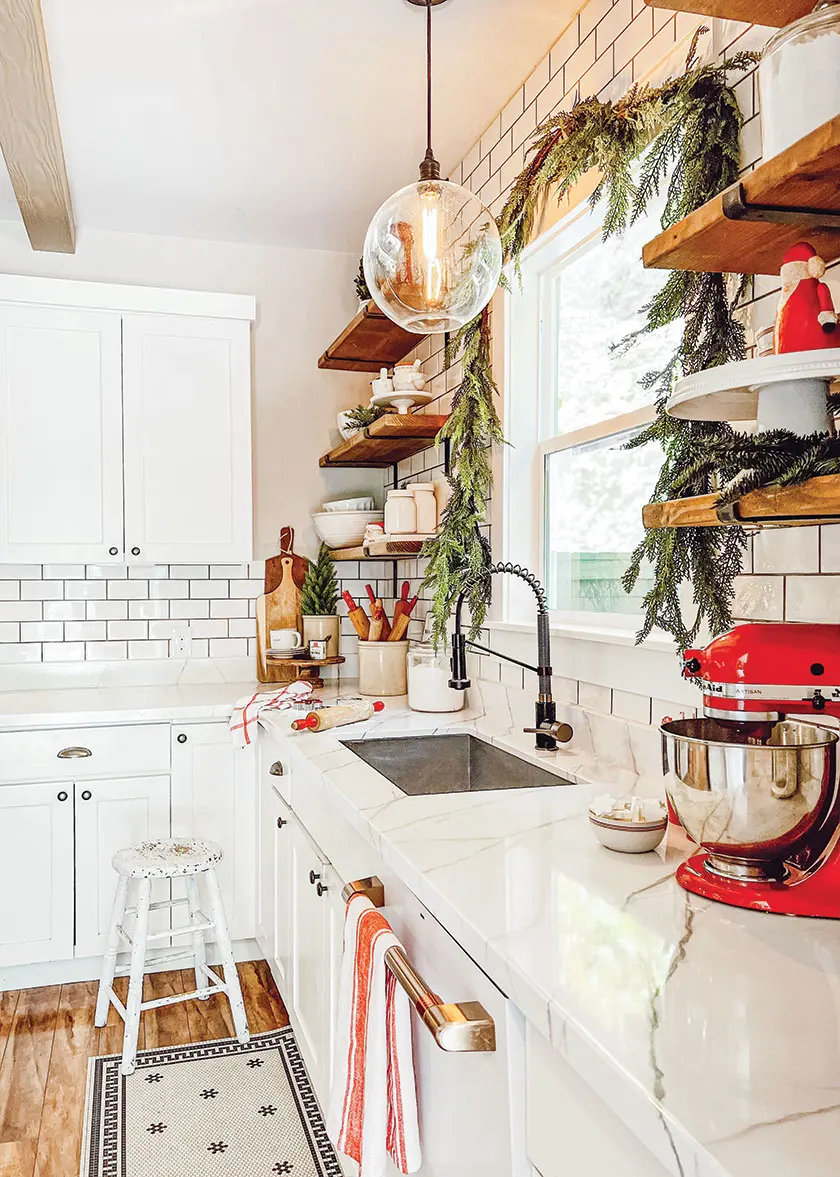 cedar garland and red Christmas figurine on exposed shelf