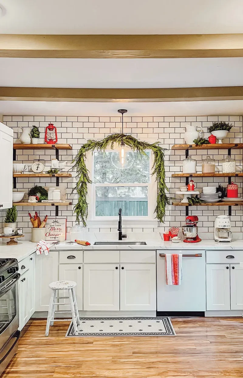 cozy Christmas kitchen with cedar garland over the window