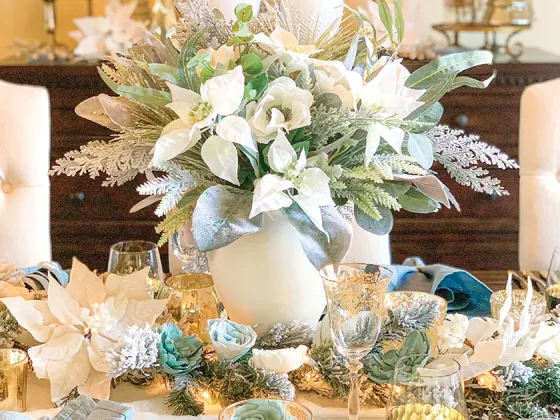 Christmas floral arrangement with white poinsettias and eucalyptus
