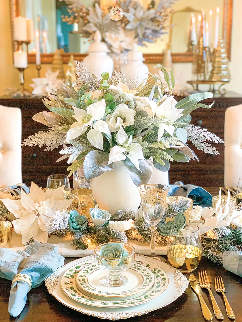 Christmas floral arrangement with white poinsettias and eucalyptus