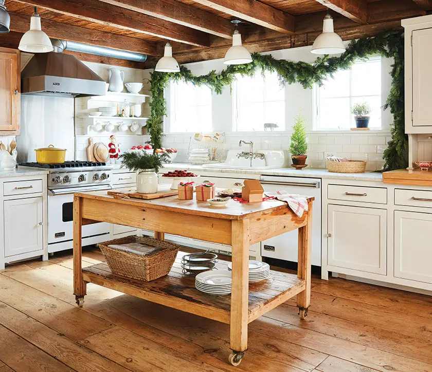 kitchen with natural greenery garland and red vintage accents