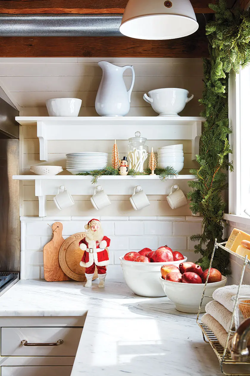 vintage Santa and snow man figurine in Christmas cottage kitchen