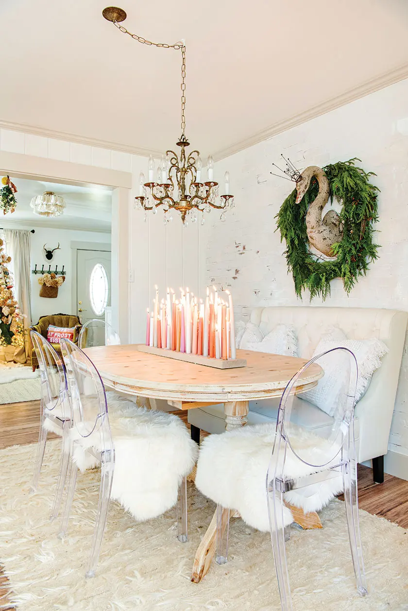 white pink and coral tapers and garland around swan figurine