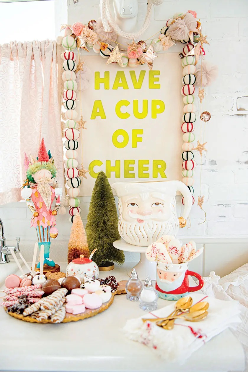 festive coffee bar with beaded garland and vintage Santa mugs