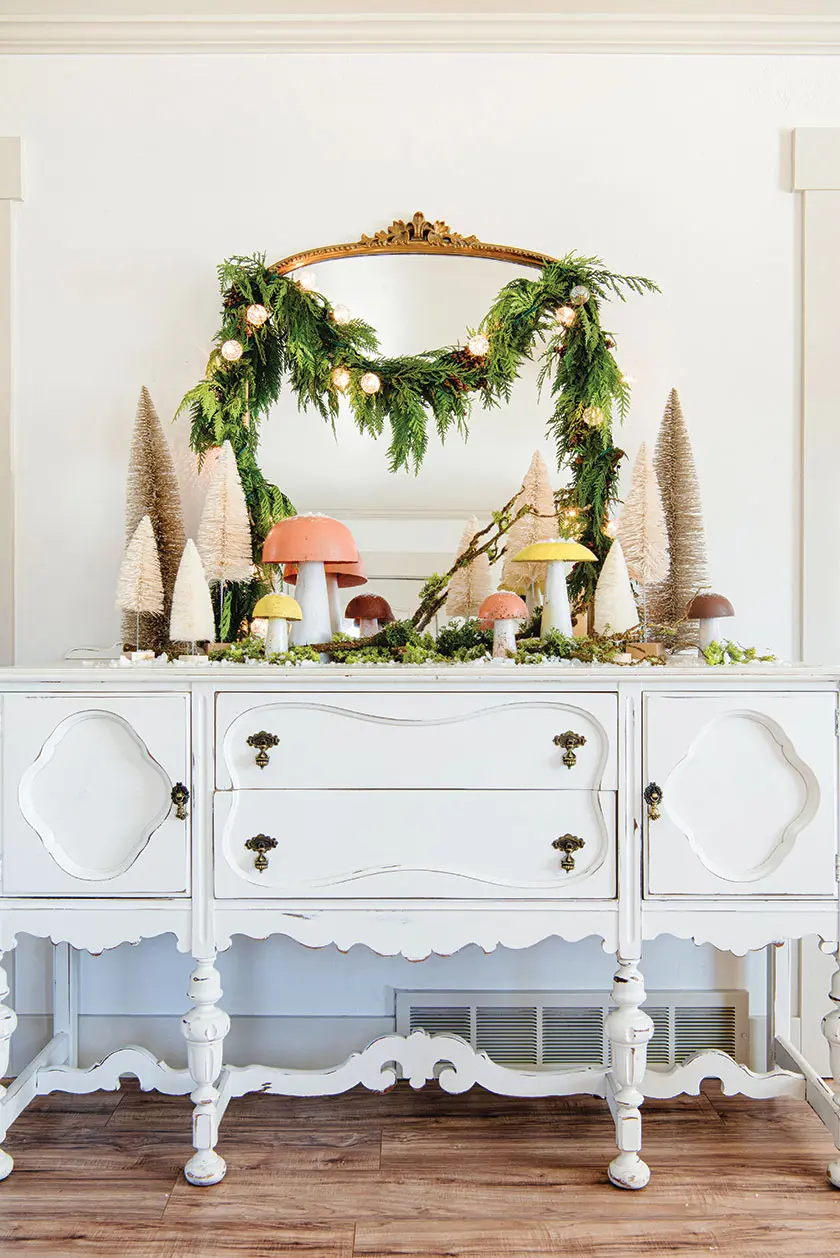 lighted cedar garland with bottlebrush tree vignette and faux mushrooms