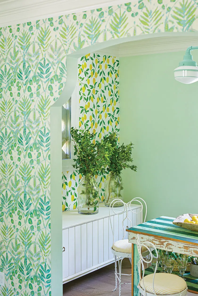 leaf and lemon wallpaper and mint green accent wall in Annie Villa