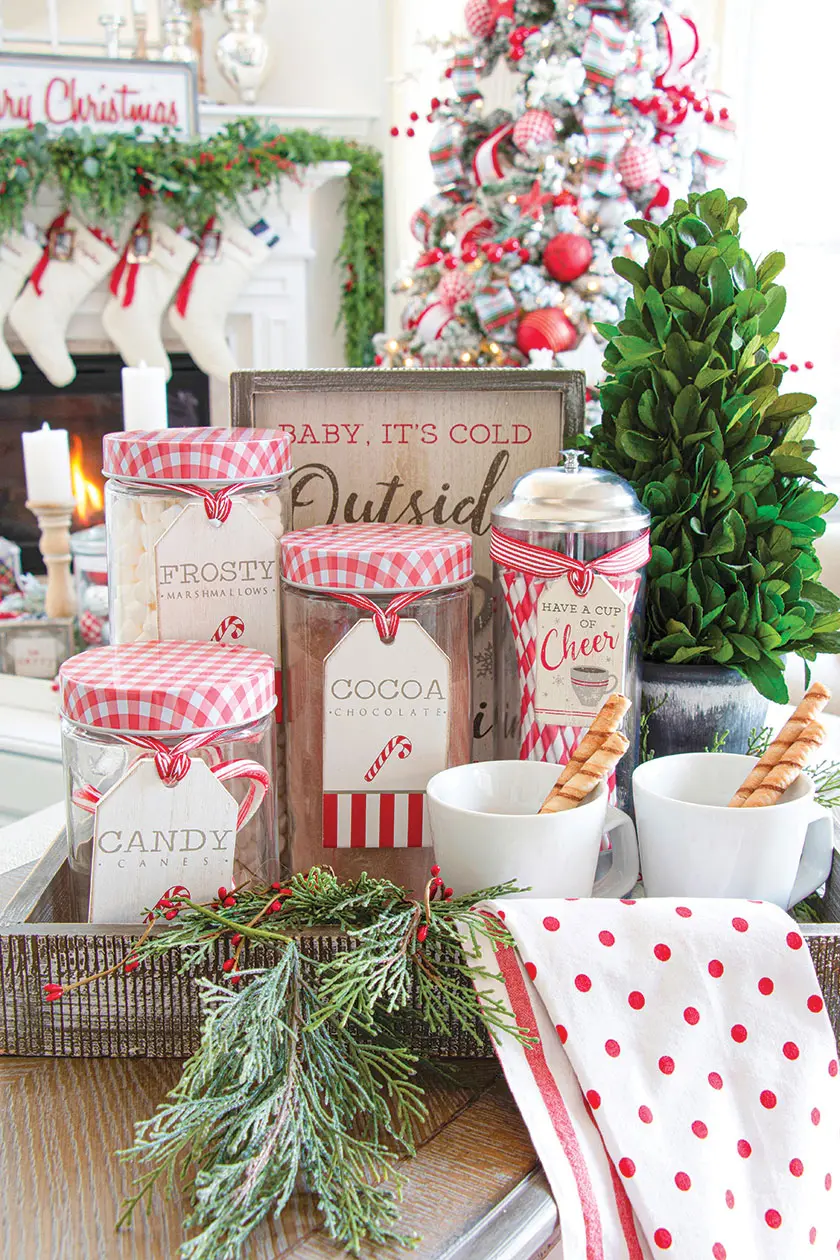 hot chocolate accoutrements in front of Christmas tree in magical holiday home