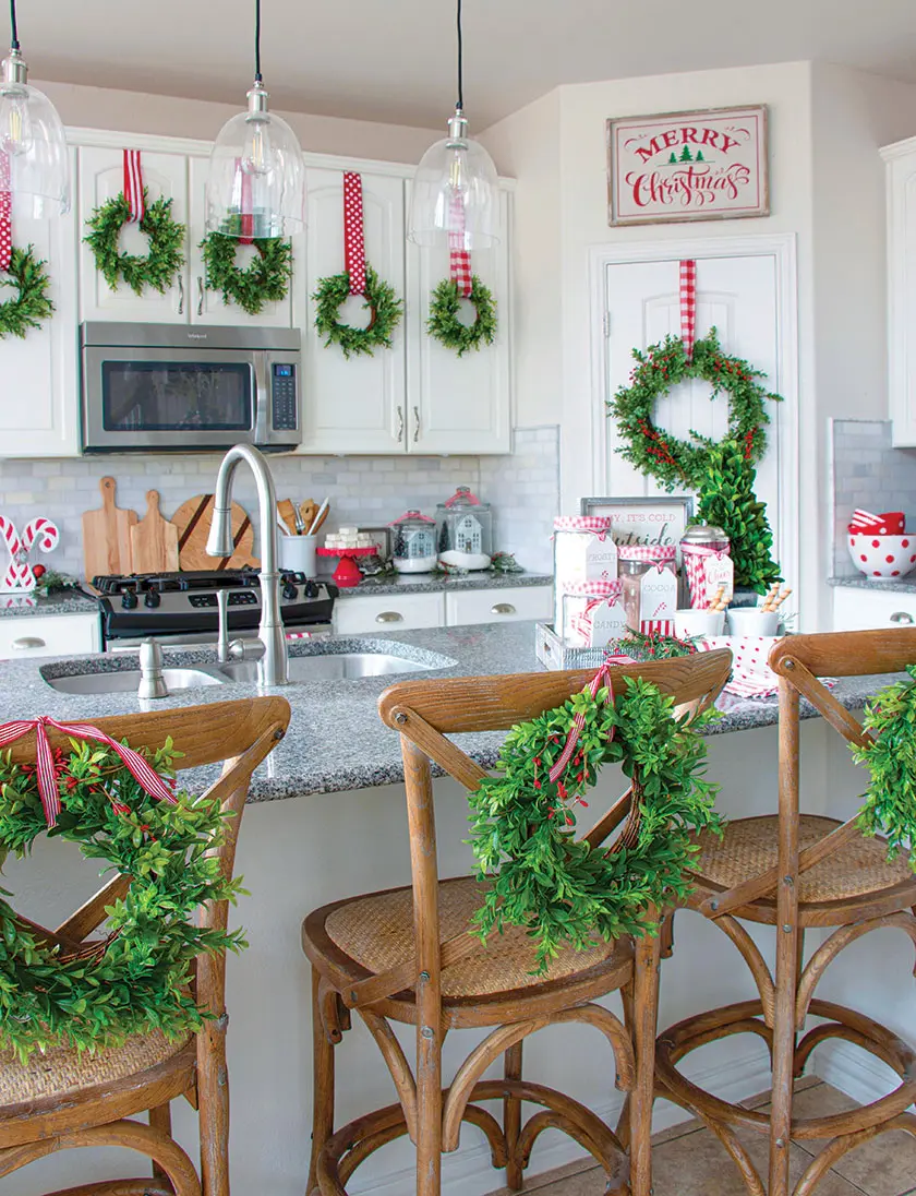 kitchen with wreaths on cabinets and kitchen stools