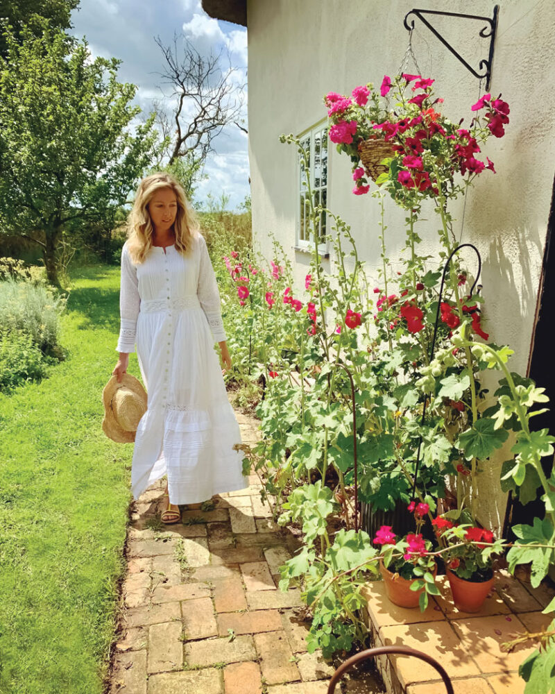 Rebecca outside her historic countryside cottage