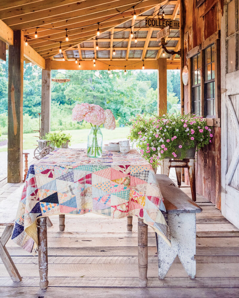 quilt as tablecloth and hydrangea flower arrangement as centerpiece