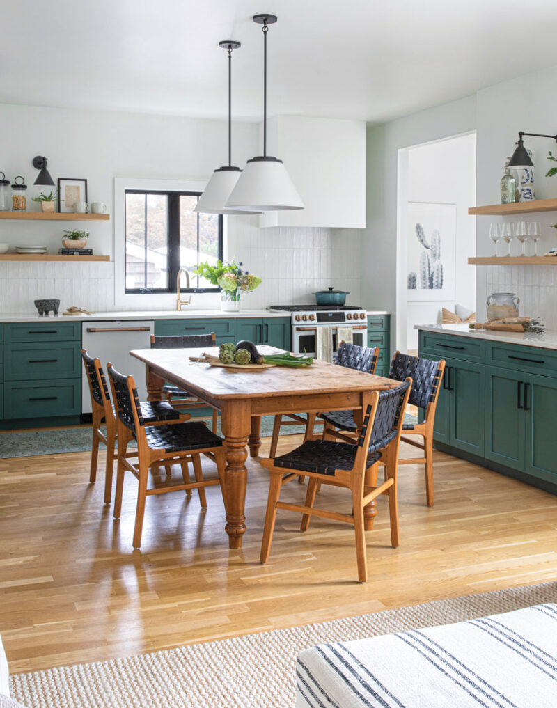 dining room in sophisticated beach bungalow with modern dining chairs