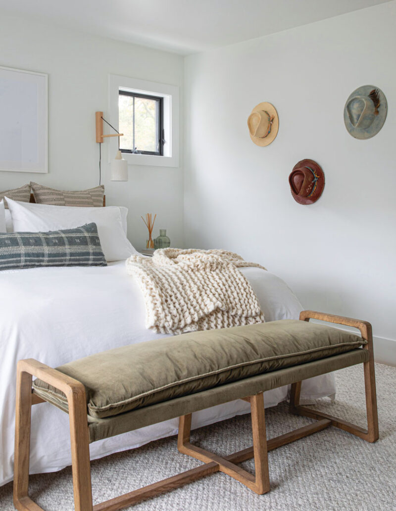 hats as wall decor in primary bedroom