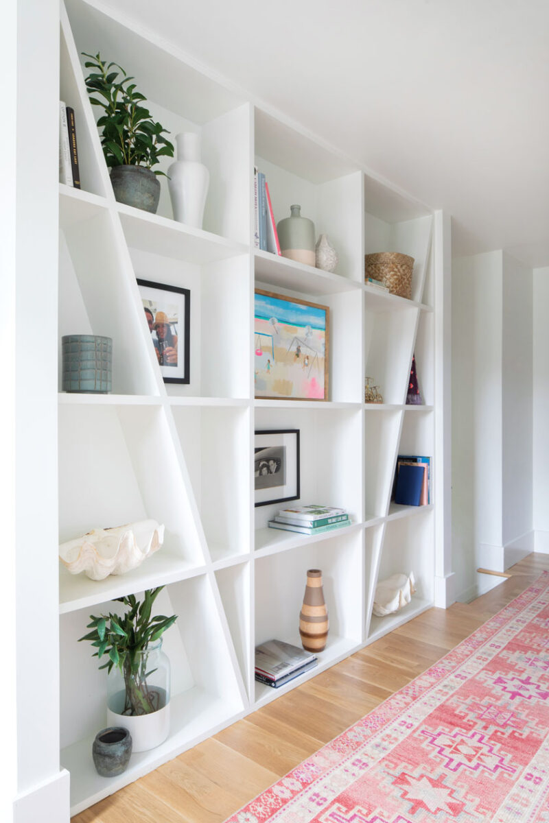 angled display shelves and vintage runner