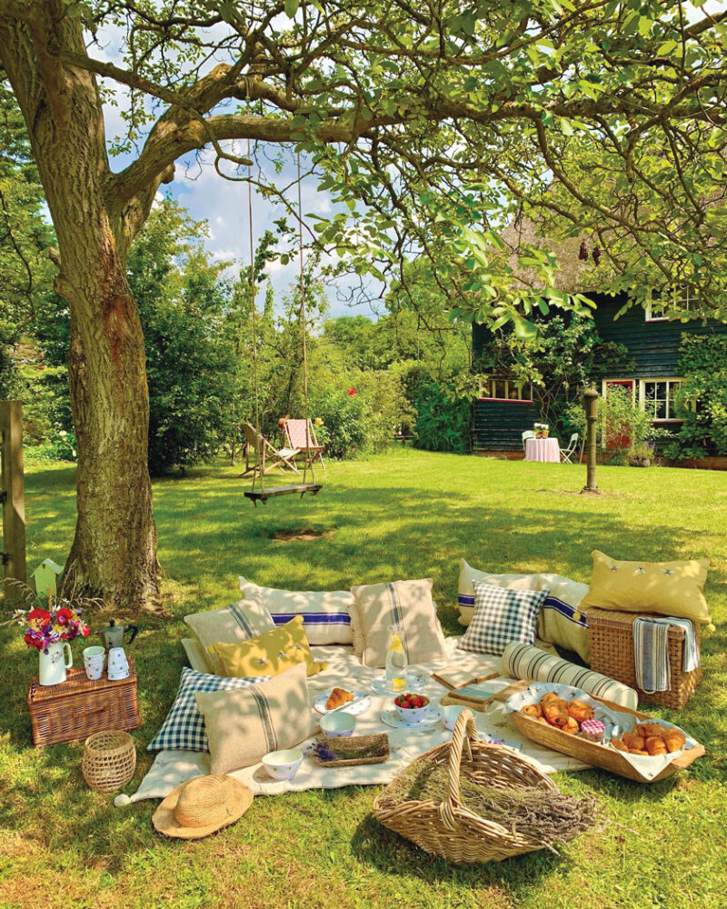 picnic in lawn of English countryside cottage