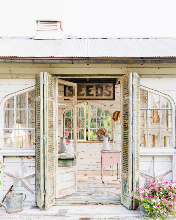 flower house with flower arrangements in vintage pitchers