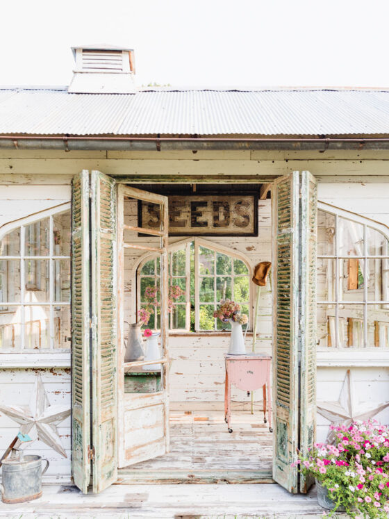 flower house with flower arrangements in vintage pitchers