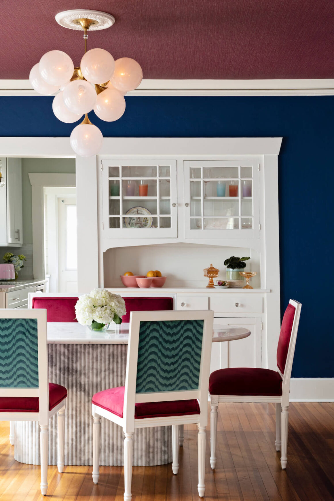 contemporary table and chandelier in craftsman home