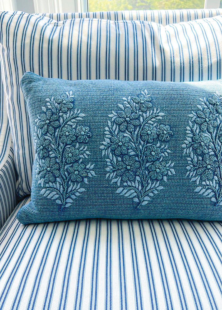 blue embroidered pillow