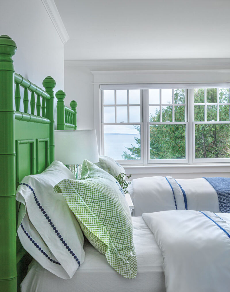 green bedframe and lakeside view in Lake Michigan cottage