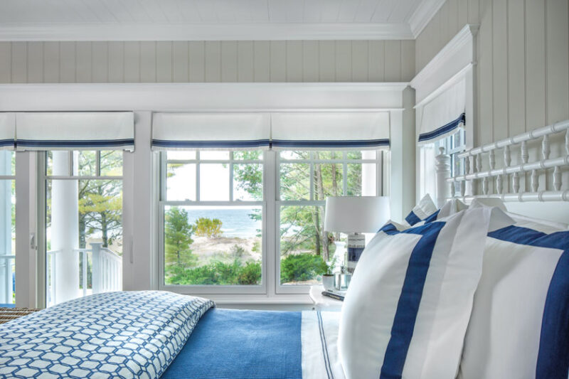 lakeside view and blue bedding from cottage bedroom