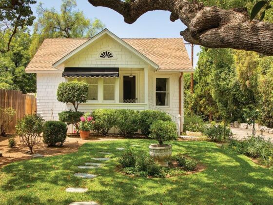 exterior of small cottage with stone walkway