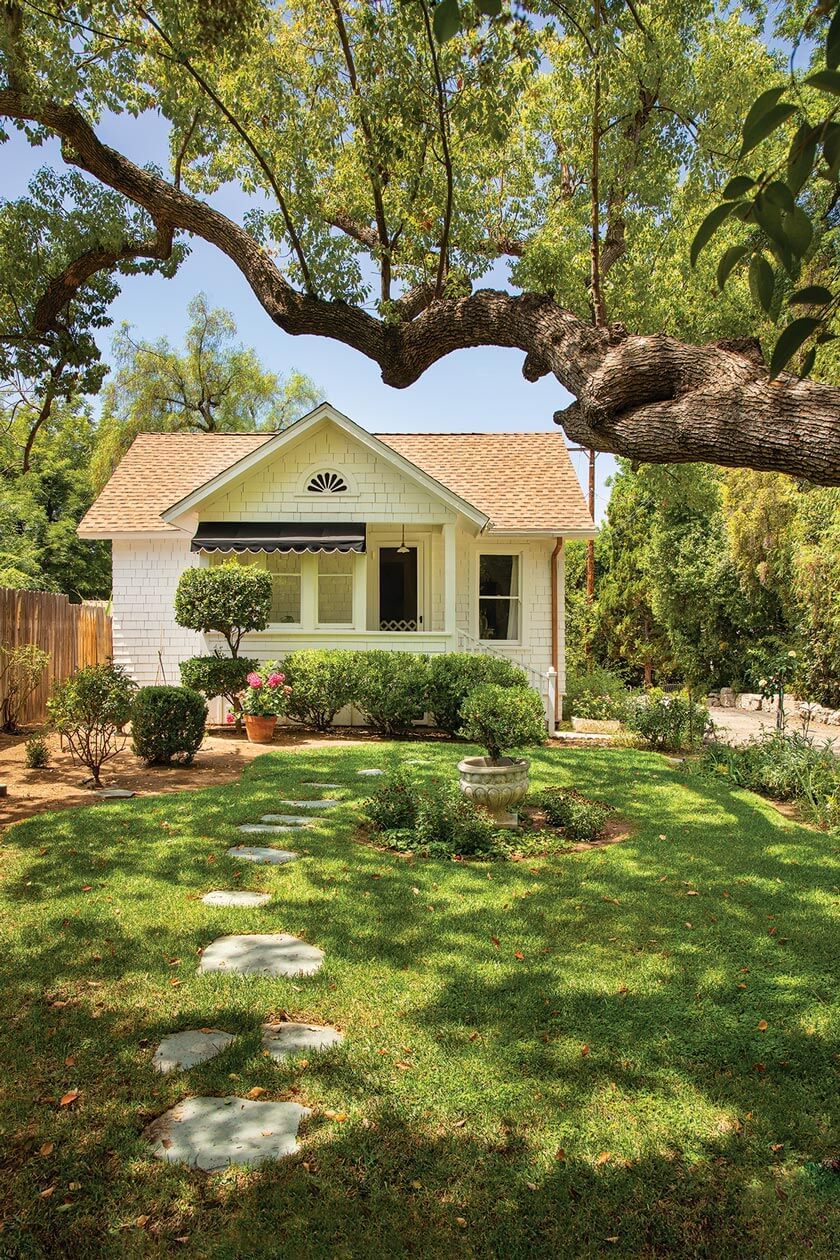 exterior of small cottage with stone walkway