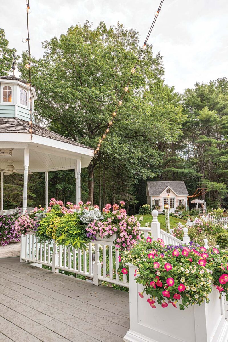 flowers surrounding porch in Maine home garden
