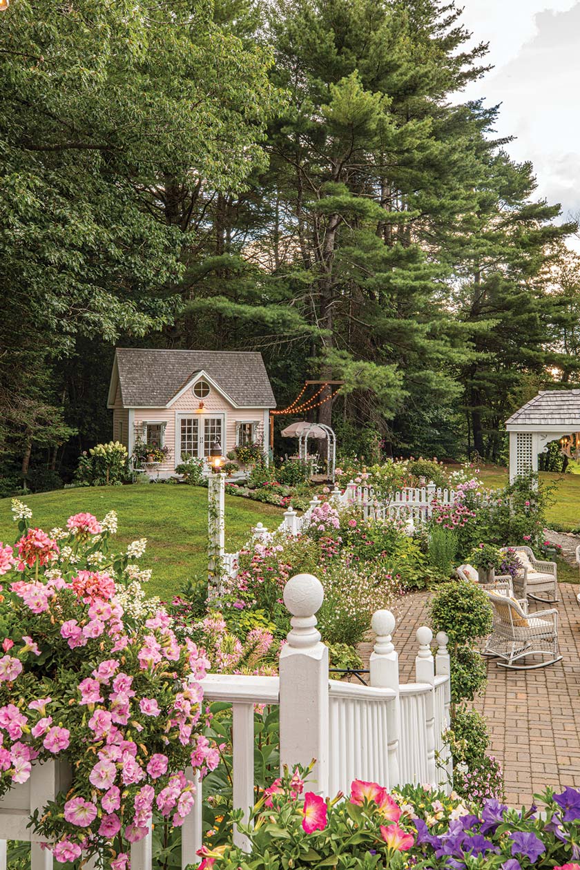 patio and garden path to she shed in Maine home