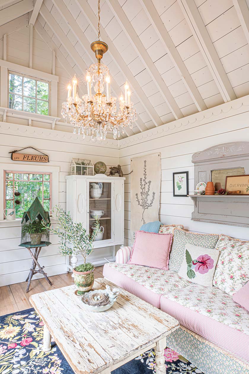 she shed with white shiplap cathedral ceiling and chandelier
