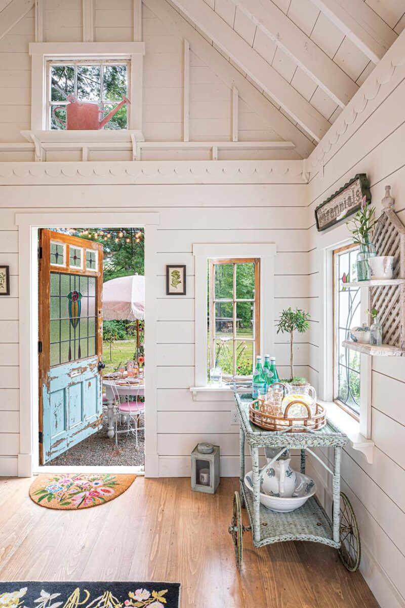 she shed door built around antique stained glass window