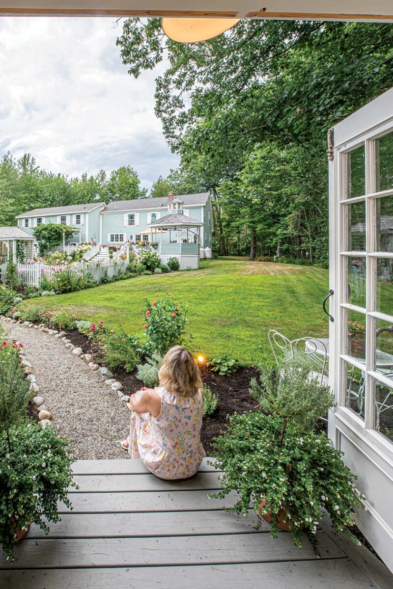 Erin looking over Maine home gardens