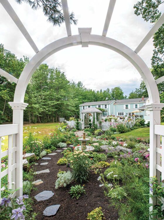 view of walkway and gardens in home gardens in Maine