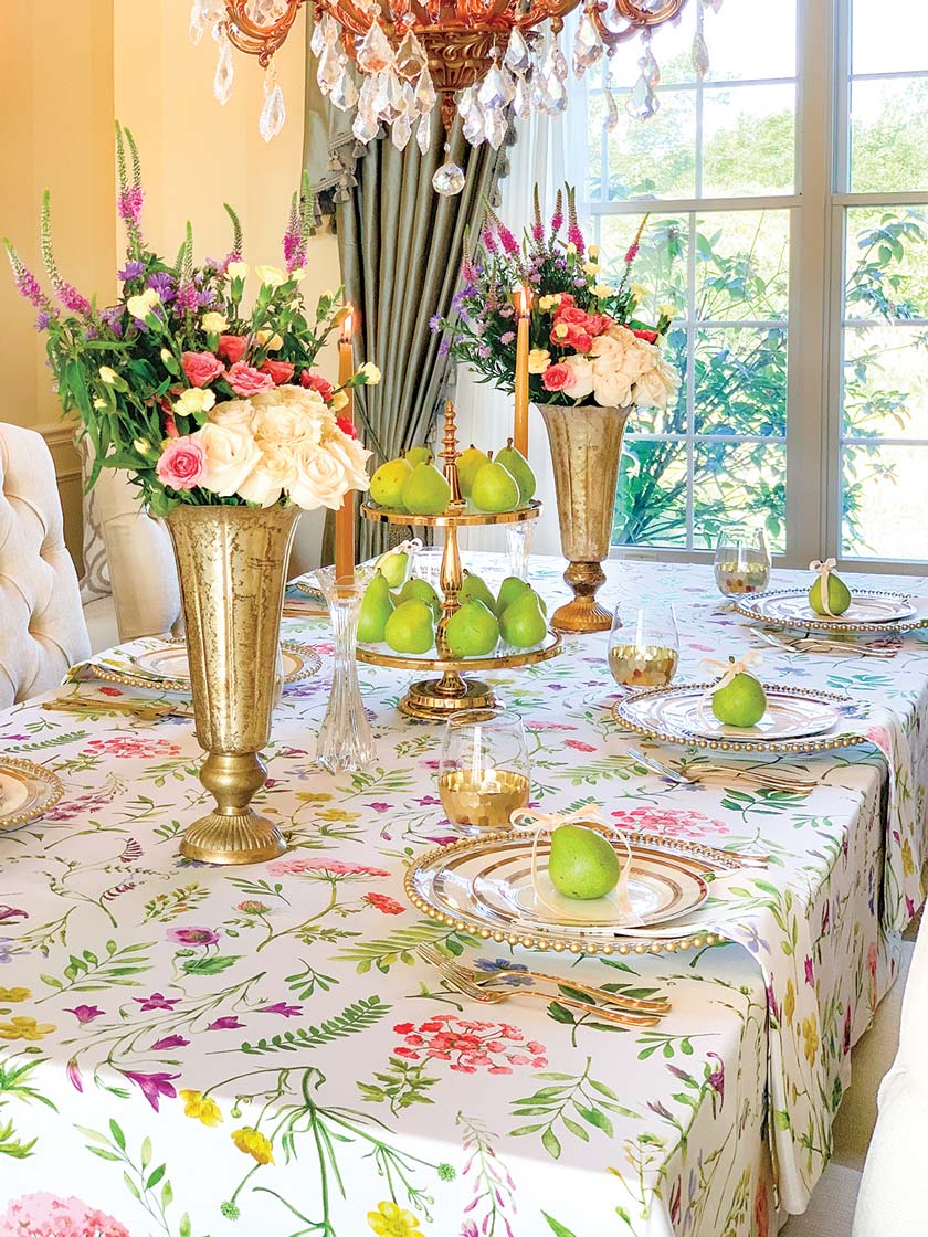 floral tablecloth and pears and bouquets as accents for summer tablescape
