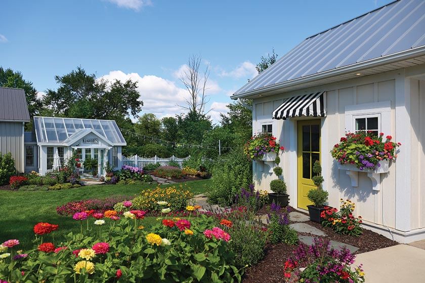 pool house with flower boxes and greenhouse