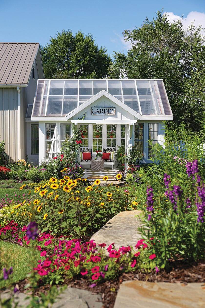 flowers planted outside home greenhouse