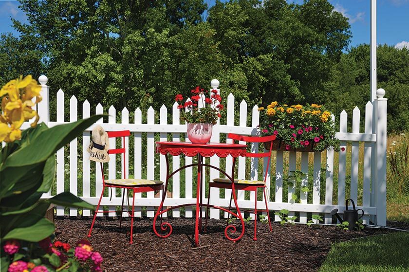 cottage garden style white picket fence