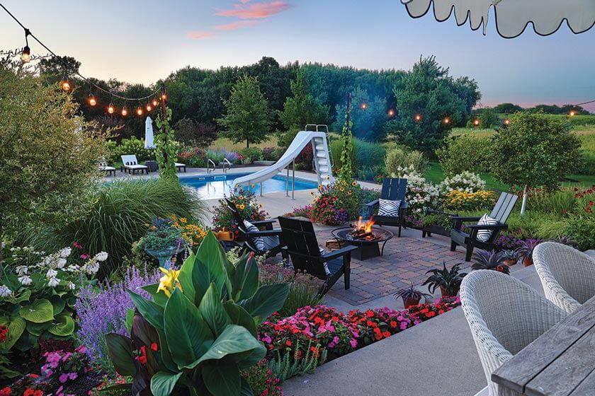 Michigan home with backyard pool firepit and landscaping