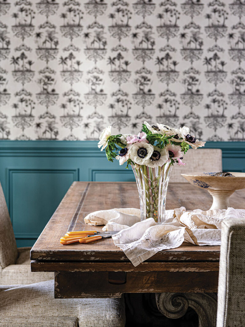 dining room with vase of cut flowers