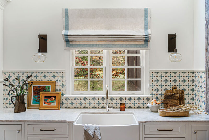 Old World blue and white valence and tile pattern in renovated kitchen