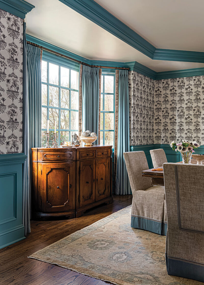 dining room with blue detail and Old World wallpaper