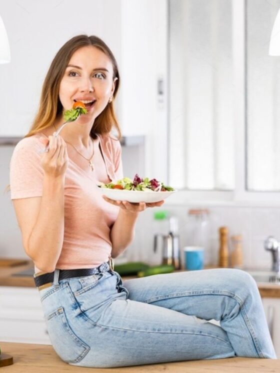 a english girl eating salad on kitchen table