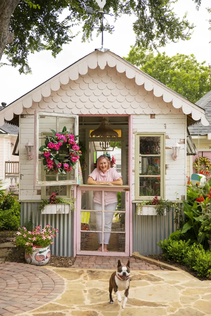 Wendy in her greenhouse where she operates her decorating business